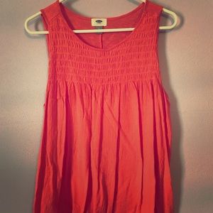 Orange/coral color tank.